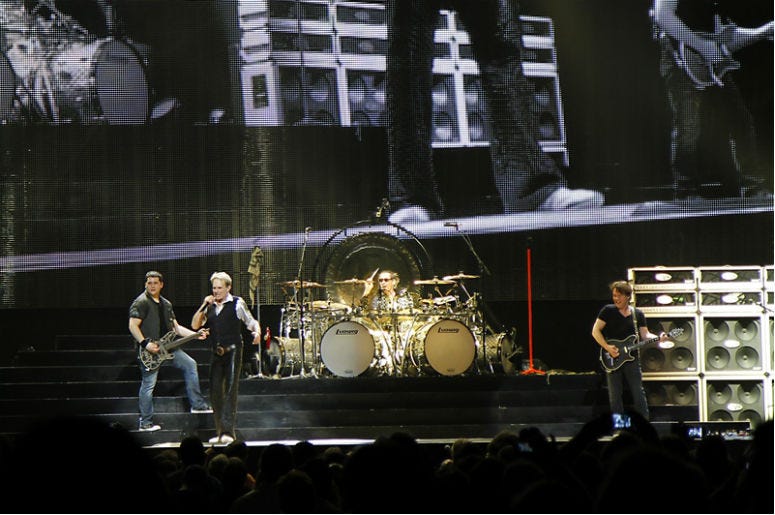 Van Halen in concert at the Amway center in Orlando Florida; with original singer David Lee Roth. The group is on their 2012 North America Tour Van Halen in concert at the Amway center in Orlando Florida; with original singer David Lee Roth. The group is on their 2012 North America Tour
