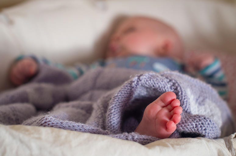 Sleeping babies study 5/19/2017 - File photo dated 24/1/2016 of a baby sleeping in a basket. Getting babies to sleep well at night may halve their risk of obesity as toddlers, research suggests. (Photo by PA Images/Sipa USA)