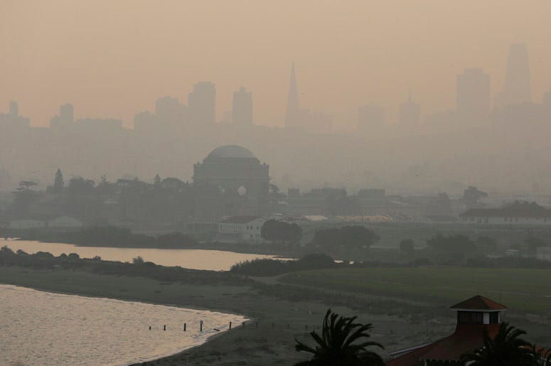 San Francisco city skyline are obscured due to smoke and haze from wildfires. San Francisco city skyline are obscured due to smoke and haze from wildfires.