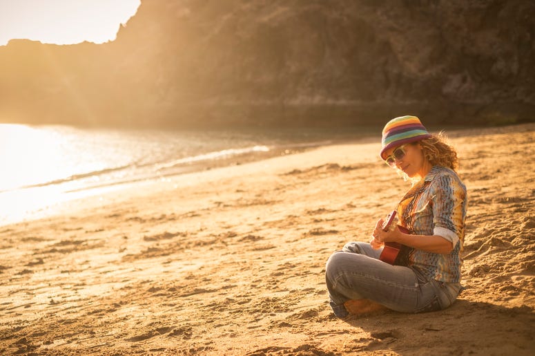 Guitar girl on beach