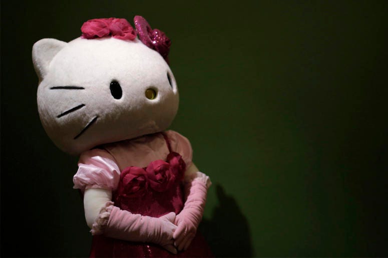 AP19190483751582 In this Thursday, Oct. 30, 2014 file photo, a model dressing as Japanese character Hello Kitty waits for guests to pose for a souvenir photo at Sanrio Puroland, a theme park featuring Hello Kitty in Tokyo. (AP Photo/Eugene Hoshiko, File)