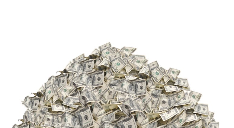 a pile of dollar bills