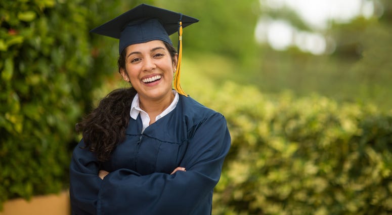 girl wearing graduation cap and gown