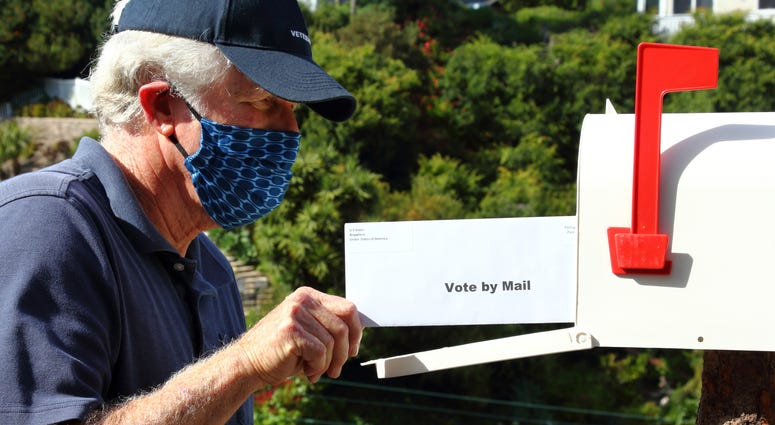 man voting by mail