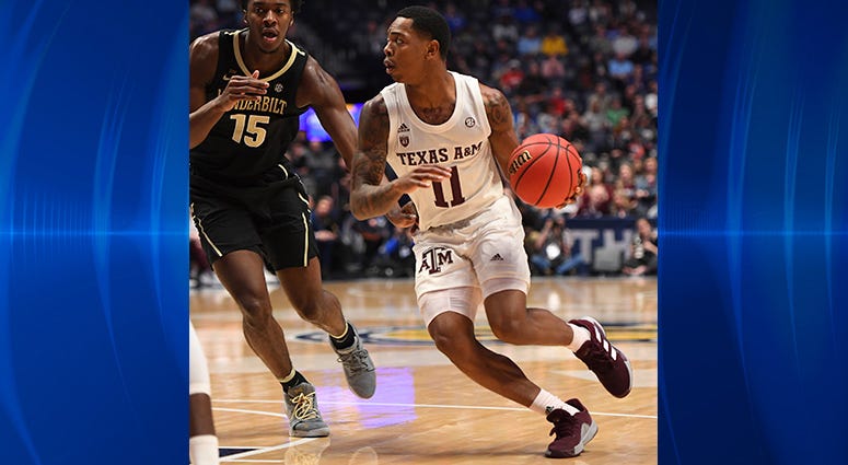 Texas A&M Aggies guard Wendell Mitchell (11) dribbles the ball around Vanderbilt Commodores forward Clevon Brown (15) during the first half of the SEC conference tournament at Bridgestone Arena. Texas A&M Aggies guard Wendell Mitchell (11) dribbles the ball around Vanderbilt Commodores forward Clevon Brown (15) during the first half of the SEC conference tournament at Bridgestone Arena.