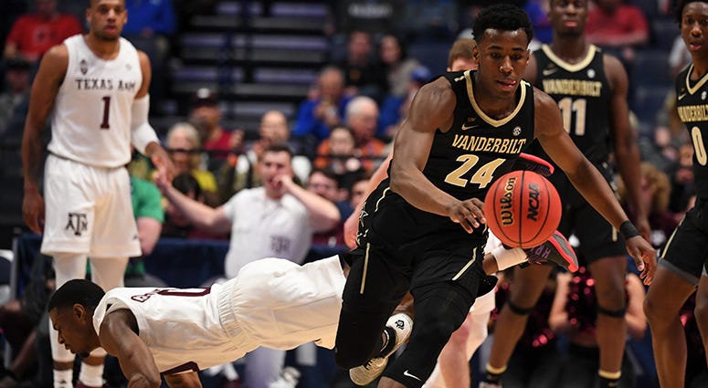 Vanderbilt Commodores forward Aaron Nesmith (24) chases down a loose ball after an attempted steal by Texas A&M Aggies guard Jay Jay Chandler (0) during the first half of the SEC conference tournament at Bridgestone Arena. Vanderbilt Commodores forward Aaron Nesmith (24) chases down a loose ball after an attempted steal by Texas A&M Aggies guard Jay Jay Chandler (0) during the first half of the SEC conference tournament at Bridgestone Arena.