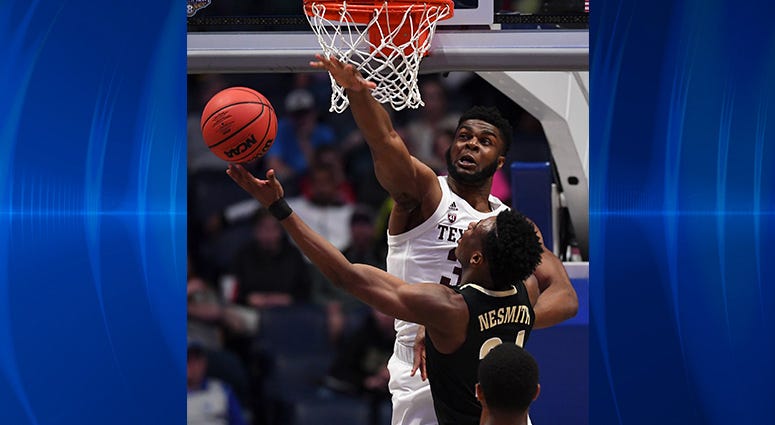 Texas A&M Aggies forward Josh Nebo (32) attempts to block a shot attempt by Vanderbilt Commodores forward Aaron Nesmith (24) during the first half of the SEC conference tournament at Bridgestone Arena. Texas A&M Aggies forward Josh Nebo (32) attempts to block a shot attempt by Vanderbilt Commodores forward Aaron Nesmith (24) during the first half of the SEC conference tournament at Bridgestone Arena.