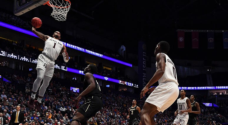 Texas A&M Aggies guard Savion Flagg (1) dunks the ball during the first half against the Vanderbilt Commodores of the SEC conference tournament at Bridgestone Arena. Texas A&M Aggies guard Savion Flagg (1) dunks the ball during the first half against the Vanderbilt Commodores of the SEC conference tournament at Bridgestone Arena.