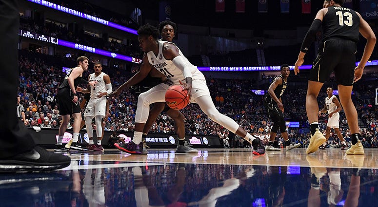 Texas A&M Aggies forward Christian Mekowulu (21) drives to the basket against the Vanderbilt Commodores during the first half of the SEC conference tournament at Bridgestone Arena. Texas A&M Aggies forward Christian Mekowulu (21) drives to the basket against the Vanderbilt Commodores during the first half of the SEC conference tournament at Bridgestone Arena.