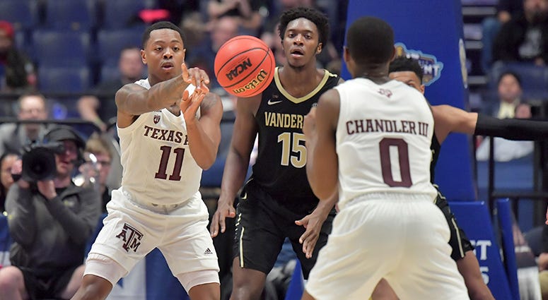 exas A&M Aggies guard Wendell Mitchell (11) passes the ball against the Vanderbilt Commodores in the SEC conference tournament at Bridgestone Arena. exas A&M Aggies guard Wendell Mitchell (11) passes the ball against the Vanderbilt Commodores in the SEC conference tournament at Bridgestone Arena.