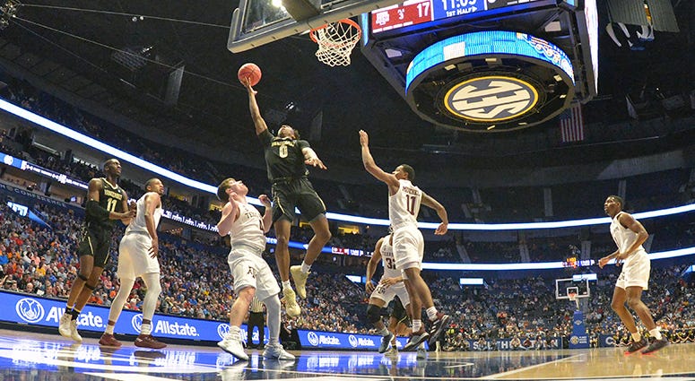Vanderbilt Commodores guard Saben Lee (0) shoots the ball against the Texas A&M Aggies during the first half of game two in the SEC conference tournament at Bridgestone Arena. Vanderbilt Commodores guard Saben Lee (0) shoots the ball against the Texas A&M Aggies during the first half of game two in the SEC conference tournament at Bridgestone Arena.