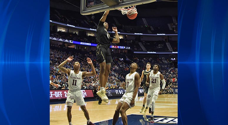 Vanderbilt Commodores guard Saben Lee (0) dunks the ball against the Texas A&M Aggies during the first half of game two in the SEC conference tournament at Bridgestone Arena. Vanderbilt Commodores guard Saben Lee (0) dunks the ball against the Texas A&M Aggies during the first half of game two in the SEC conference tournament at Bridgestone Arena.