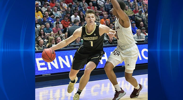 Vanderbilt Commodores forward Yanni Wetzell (1) is defended by Texas A&M Aggies guard Wendell Mitchell (11) during the first half of game two in the SEC conference tournament at Bridgestone Arena. Vanderbilt Commodores forward Yanni Wetzell (1) is defended by Texas A&M Aggies guard Wendell Mitchell (11) during the first half of game two in the SEC conference tournament at Bridgestone Arena.