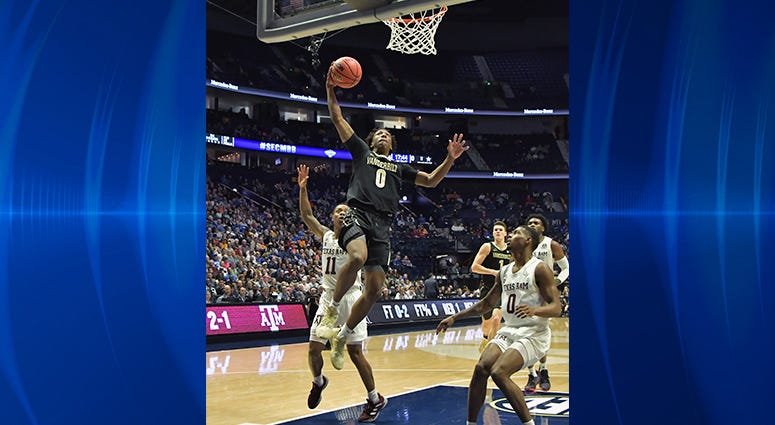 Vanderbilt Commodores guard Saben Lee (0) dunks the ball against the Texas A&M Aggies during the first half of game two in the SEC conference tournament at Bridgestone Arena. Vanderbilt Commodores guard Saben Lee (0) dunks the ball against the Texas A&M Aggies during the first half of game two in the SEC conference tournament at Bridgestone Arena.
