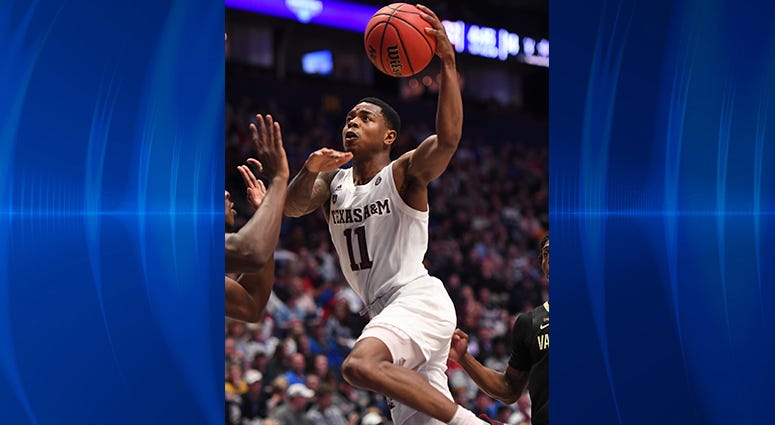 Texas A&M Aggies guard Wendell Mitchell (11) shoots the ball against the Vanderbilt Commodores during the first half of the SEC conference tournament at Bridgestone Arena. Texas A&M Aggies guard Wendell Mitchell (11) shoots the ball against the Vanderbilt Commodores during the first half of the SEC conference tournament at Bridgestone Arena.