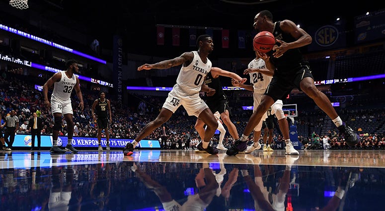 Vanderbilt Commodores guard Joe Toye (2) works against Texas A&M Aggies guard Jay Jay Chandler (0) during the second half of the SEC conference tournament at Bridgestone Arena. Vanderbilt Commodores guard Joe Toye (2) works against Texas A&M Aggies guard Jay Jay Chandler (0) during the second half of the SEC conference tournament at Bridgestone Arena.
