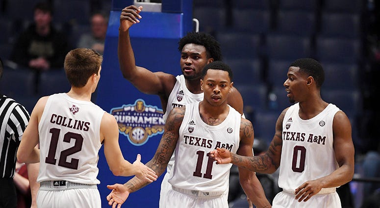 Texas A&M Aggies players celebrate after a basket by Texas A&M Aggies guard Wendell Mitchell (11) during the second half of the SEC conference tournament at Bridgestone Arena. Texas A&M Aggies players celebrate after a basket by Texas A&M Aggies guard Wendell Mitchell (11) during the second half of the SEC conference tournament at Bridgestone Arena.