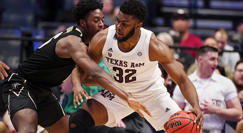 Texas A&M Aggies forward Josh Nebo (32) works against Vanderbilt Commodores forward Clevon Brown (15) during the second half of the SEC conference tournament at Bridgestone Arena. Texas A&M Aggies forward Josh Nebo (32) works against Vanderbilt Commodores forward Clevon Brown (15) during the second half of the SEC conference tournament at Bridgestone Arena.