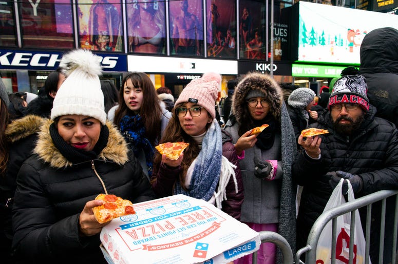 People eating Pizza in Times Square