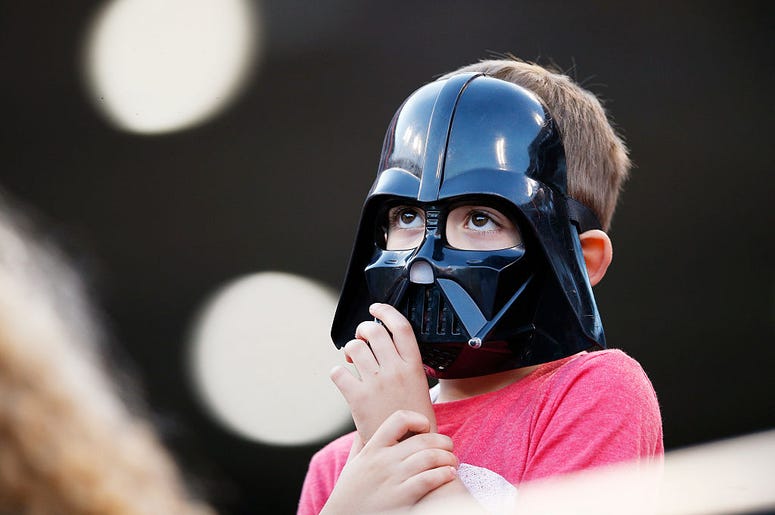 Kid in a Darth Vader mask