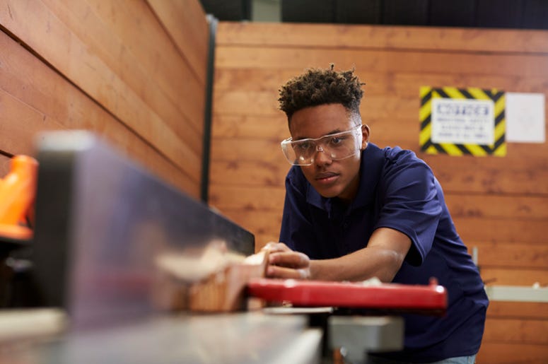 Kid Cutting Wood