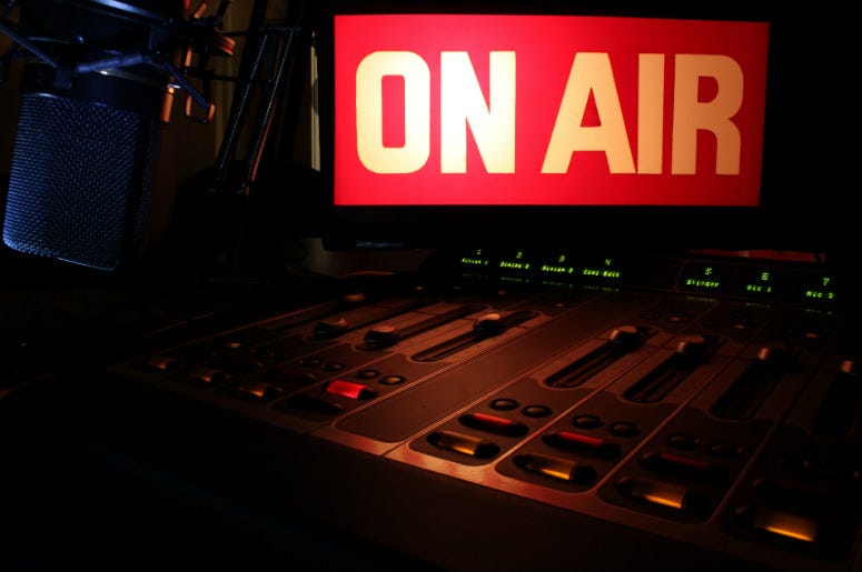 On Air sign glowing, reflecting light on a radio studio broadcast panel. Seattle,Radio,Alternative,Rock,KEXP,FM,90.5,Donation,Estate,10 Million,Money,Station,Suzanne,Giving,100.3 Jack FM