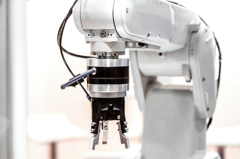 Industrial robot arm close up. IKEA,Furniture,Assembly,Video,Robot,Build,Singapore,Machine,Technology,100.3 Jack FM