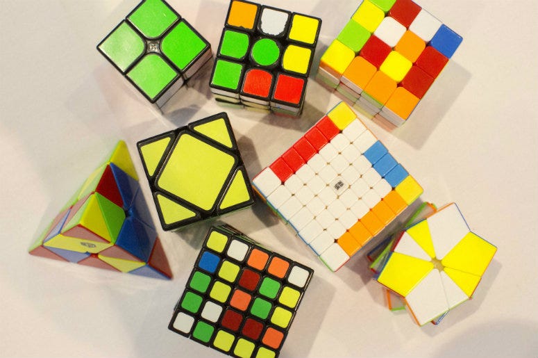 variety of different Rubik's Cubes on the table during the finals of the Rubik Speedcubing UK Championship Rubik's Cube,Three,Juggling,Solve,Fastest,World Record,China,Video,12-Year-Old,Boy,100.3 Jack FM