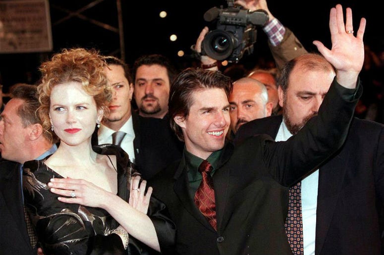 Tom Cruise waves to fans as he and his wife actress Nicole Kidman arrive for the premiere of his latest Oscar-nominated film "Jerry Maguire" Nine,Nine @ 9,Jack,List,Tom Cruise,Music,1993,July 6,100.3 Jack FM