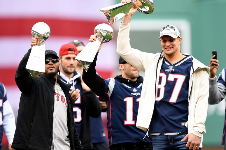 Rob Gronkowski holds up a Lombardi Trophy
