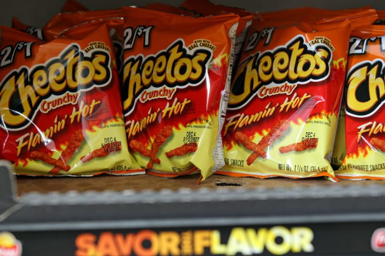 Bags of Flamin' Hot Cheetos`