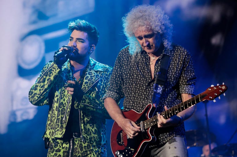 Adam Lambert (L) performs with Brian May of Queen during Fire Fight Australia at ANZ Stadium on February 16, 2020 in Sydney, Australia. Adam Lambert (L) performs with Brian May of Queen during Fire Fight Australia at ANZ Stadium on February 16, 2020 in Sydney, Australia.