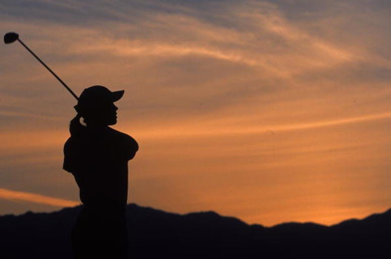 A silhouette of woman as she follows her shot A silhouette of woman as she follows her shot