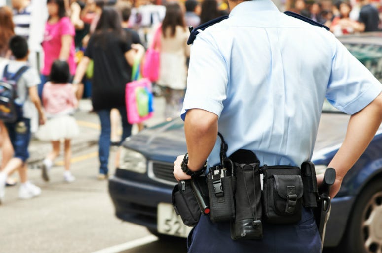 A police officer patrols city streets. 100.3 Jack FM,Hasta Muerte Coffee,Shop,Co-Op,Employee,Owned,Oakland,Policy,Police,Cops,Refused Service,Officer,Uniform,Instagram,Safety,Coustomers