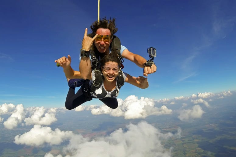 A couple tandem skydiving. 100.3 Jack FM,Skydiving,Proposal,Engaged,Video,Viral,Marriage,Extreme,Couple,Fiance