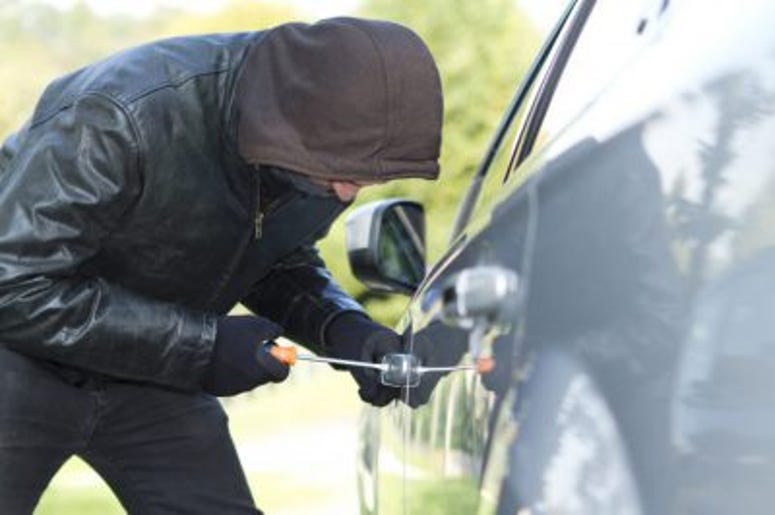 Man attempts to steal a car. Car, Thief, Stolen, Crime