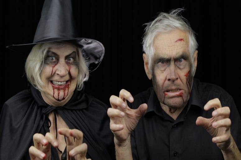 Elderly man and woman in Halloween costumes Elderly man and woman in Halloween costumes