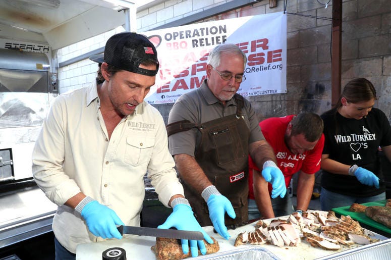 Matthew McConaughey cutting up meat