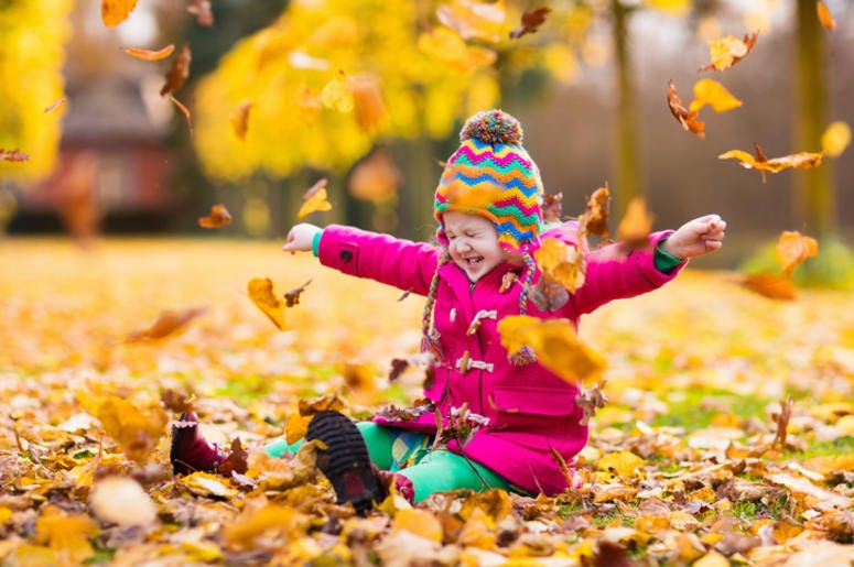 Kid Playing in the leaves
