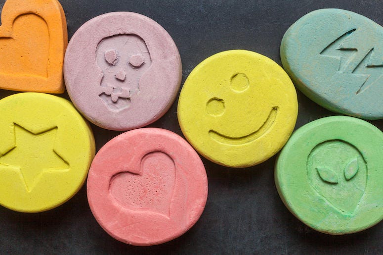 MDMA, Molly, Ecstacy, Drugs, Black Background MDMA, Molly, Ecstacy, Drugs, Black Background