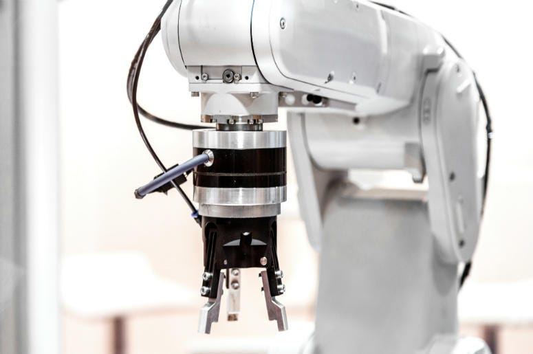 Industrial robot arm close up. IKEA,Furniture,Assembly,Video,Robot,Build,Singapore,Machine,Technology,100.3 Jack FM