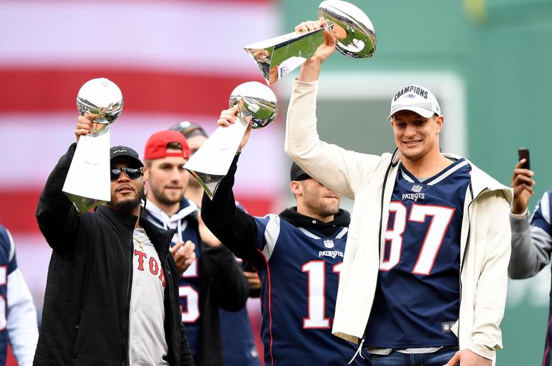 Rob Gronkowski holds up a Lombardi Trophy