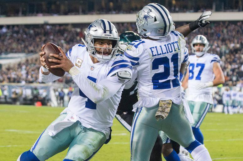 Cowboys quarterback Dak Prescott (4) carries the ball just shy of the goal line against the Eagles, alongside Zeke Elliot (21) Cowboys quarterback Dak Prescott (4) carries the ball just shy of the goal line against the Eagles, alongside Zeke Elliot (21)