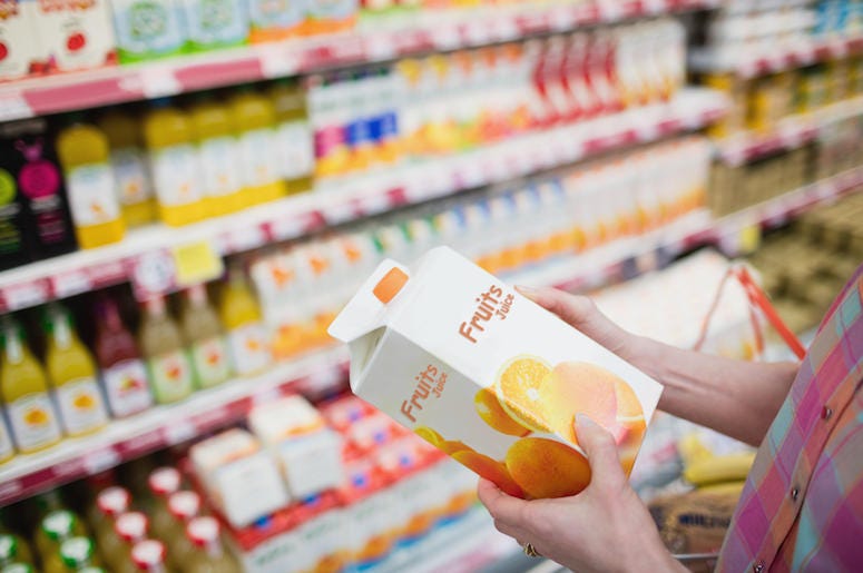 Hands Holding Juice, Grocery Store, Carton Hands Holding Juice, Grocery Store, Carton
