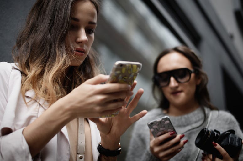 Girls texting on phone Girls texting on phone