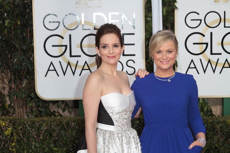 Actress and Co-Host Tina Fey and Amy Poehler arrive at the 72nd Annual Golden Globe Awards Actress and Co-Host Tina Fey and Amy Poehler arrive at the 72nd Annual Golden Globe Awards
