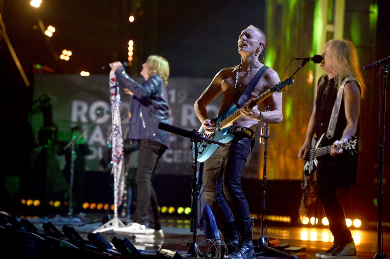 Inductees Joe Elliott, Phil Collen and Rick Savage of Def Leppard perform at the 2019 Rock & Roll Hall Of Fame Induction Ceremony Inductees Joe Elliott, Phil Collen and Rick Savage of Def Leppard perform at the 2019 Rock & Roll Hall Of Fame Induction Ceremony