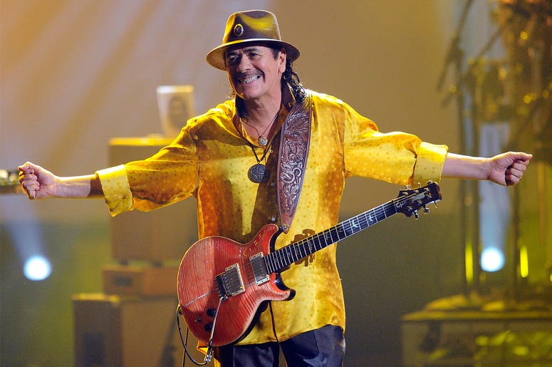 Carlos Santana LOS ANGELES, CA - NOVEMBER 21: Musician Carlos Santana performs onstage during the 2010 American Music Awards held at Nokia Theatre L.A. Live on November 21, 2010 in Los Angeles, California. (Photo by Kevork Djansezian/Getty Images for DCP)