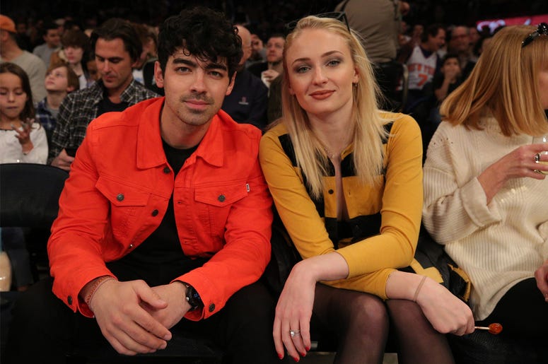Joe Jonas and fiance Sophie Turner Mar 9, 2019; New York, NY, USA; American musician Joe Jonas (left) sits with British actress Sophie Turner during the first quarter between the New York Knicks and the Sacramento Kings at Madison Square Garden. Mandatory Credit: Brad Penner-USA TODAY Spor