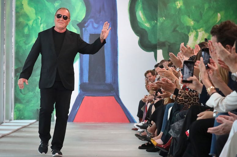 AP18255643346307 Fashion designer Michael Kors acknowledges applause after unveiling his latest collection during Fashion Week, Wednesday, Sept. 12, 2018, in New York. (AP Photo/Bebeto Matthews)
